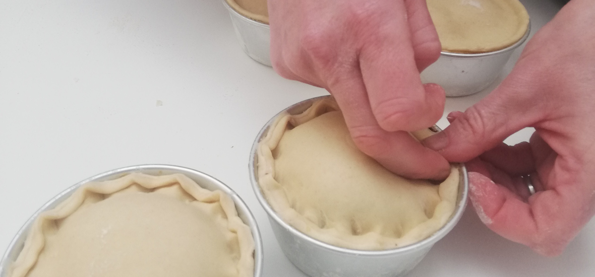 One of our chefs hand making some pies